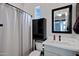 Clean bathroom with a shower/tub combination, framed mirror, vanity, and toilet at 226 E Markwood Dr, Chandler, AZ 85286