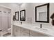 Bright bathroom featuring double sinks, framed mirrors, and a shower/tub combo at 226 E Markwood Dr, Chandler, AZ 85286