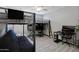 Bedroom with lofted bed, futon, desk, ceiling fan and modern laminate flooring at 226 E Markwood Dr, Chandler, AZ 85286