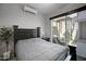 Comfortable bedroom featuring a sliding glass door with access to a private patio at 226 E Markwood Dr, Chandler, AZ 85286