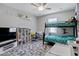 This bedroom features a bunk bed, neutral walls, ceiling fan and gray flooring at 226 E Markwood Dr, Chandler, AZ 85286