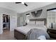 Light-filled primary bedroom offers a ceiling fan, closet and neutral colored walls at 226 E Markwood Dr, Chandler, AZ 85286