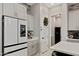 Modern kitchen with a stainless steel refrigerator and gray cabinets at 226 E Markwood Dr, Chandler, AZ 85286