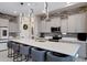 Stylish kitchen featuring a large island, modern cabinetry, and pendant lighting at 226 E Markwood Dr, Chandler, AZ 85286