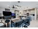 Open floor plan featuring a modern living room and kitchen island with stone accents at 226 E Markwood Dr, Chandler, AZ 85286