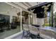Covered pergola with bar seating and views of the putting green and outdoor patio at 226 E Markwood Dr, Chandler, AZ 85286