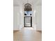 Bright foyer with high ceilings, chandelier, and modern front door at 24645 N 117Th St, Scottsdale, AZ 85255