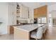 Bright modern kitchen featuring a large island with bar stools, state-of-the-art appliances, and custom cabinetry at 24645 N 117Th St, Scottsdale, AZ 85255