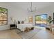 Bright, open bedroom with a sliding door leading to the backyard with a pool and views of desert landscaping at 24645 N 117Th St, Scottsdale, AZ 85255