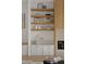 Chic shelving unit with decorative displays and accent lighting at 24645 N 117Th St, Scottsdale, AZ 85255