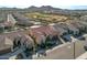 A beautiful desert community features a lush green golf course and a sparkling community pool at 25971 W Taro Dr, Buckeye, AZ 85396