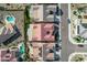 An aerial view of a residential community with swimming pools, solar panels, and a well-maintained street at 25971 W Taro Dr, Buckeye, AZ 85396