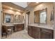 Spacious bathroom with double vanity, granite countertops and tiled flooring at 25971 W Taro Dr, Buckeye, AZ 85396