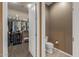 Walk-in closet with a white door and toilet room at 25971 W Taro Dr, Buckeye, AZ 85396