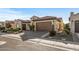 Charming single-story home featuring desert landscaping with a clay tile roof and an attached two-car garage at 25971 W Taro Dr, Buckeye, AZ 85396