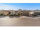 Charming single-story home featuring desert landscaping with a clay tile roof and an attached two-car garage at 25971 W Taro Dr, Buckeye, AZ 85396