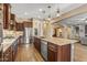 Spacious kitchen featuring large island, pendant lighting, and stainless steel appliances at 25971 W Taro Dr, Buckeye, AZ 85396