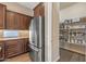 Modern kitchen featuring stainless steel appliances and a pantry at 25971 W Taro Dr, Buckeye, AZ 85396