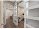 Cozy living room with hardwood floors, modern barn doors, and natural light at 25971 W Taro Dr, Buckeye, AZ 85396