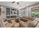 Inviting living room with fireplace, built-ins, and comfortable seating arrangement at 25971 W Taro Dr, Buckeye, AZ 85396