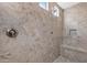 Tiled shower with a shower head and soap niche at 25971 W Taro Dr, Buckeye, AZ 85396