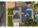 Aerial view of a well-maintained home featuring a backyard pool and lush landscaping at 2619 E Jerome Ave, Mesa, AZ 85204