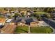 An aerial shot reveals a well-maintained home with a lush lawn, complemented by surrounding greenery at 2619 E Jerome Ave, Mesa, AZ 85204