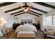 Charming bedroom with vaulted ceilings, exposed beams, and ample natural light, creating a serene retreat at 2619 E Jerome Ave, Mesa, AZ 85204