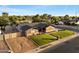 Charming single-story home with brick accents, well-manicured lawn, and a spacious driveway at 2619 E Jerome Ave, Mesa, AZ 85204