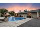 Enjoy the backyard swimming pool with a waterfall feature and a relaxing patio area for outdoor gatherings at 2619 E Jerome Ave, Mesa, AZ 85204