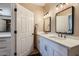 Bathroom featuring double sinks, modern fixtures, and plenty of storage at 2801 N Litchfield Rd # 65, Goodyear, AZ 85395