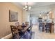 Dining area open to the kitchen, featuring a chandelier and access to other rooms at 2801 N Litchfield Rd # 65, Goodyear, AZ 85395