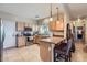Bright kitchen with tile floors, stainless steel appliances, and a breakfast bar at 2801 N Litchfield Rd # 65, Goodyear, AZ 85395