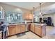 Functional kitchen with stainless steel appliances and view of the living area at 2801 N Litchfield Rd # 65, Goodyear, AZ 85395