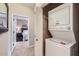 Convenient, stacked washer and dryer in laundry closet next to the bedroom entrance at 2801 N Litchfield Rd # 65, Goodyear, AZ 85395