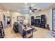 Cozy living room featuring a sectional sofa, tile flooring, and entertainment center at 2801 N Litchfield Rd # 65, Goodyear, AZ 85395