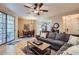 Open-concept living area with tile floors, comfortable seating, and dining area nearby at 2801 N Litchfield Rd # 65, Goodyear, AZ 85395
