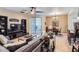 Comfortable living room with tile flooring, ceiling fan, and sliding door to the patio at 2801 N Litchfield Rd # 65, Goodyear, AZ 85395