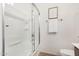 Clean bathroom featuring a white shower-tub with clear glass door and simple decor at 2986 E Country Shadows St, Gilbert, AZ 85298