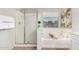 Luxurious primary bathroom showcasing a separate shower, soaking tub, and serene backyard views at 2986 E Country Shadows St, Gilbert, AZ 85298