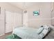 Neutral bedroom with a full size bed, soft cushions, and a sliding door closet for a comfortable stay at 2986 E Country Shadows St, Gilbert, AZ 85298