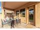 Charming covered patio features comfortable seating, creating an inviting outdoor living space at 2986 E Country Shadows St, Gilbert, AZ 85298