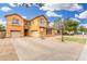 Beautiful two-story home with a long driveway, three car garage, and well-maintained landscaping at 2986 E Country Shadows St, Gilbert, AZ 85298