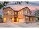 Stunning two-story home with manicured landscaping, a welcoming entrance, and a spacious three-car garage at 2986 E Country Shadows St, Gilbert, AZ 85298