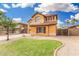 Charming two-story home with well-manicured front lawn, showcasing an inviting curb appeal at 2986 E Country Shadows St, Gilbert, AZ 85298