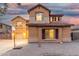 Inviting two-story home with a well-maintained front yard, basketball hoop, and three-car garage at 2986 E Country Shadows St, Gilbert, AZ 85298