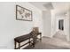 Inviting hallway featuring a decorative bench, a wall-mounted map, and neutral decor for a warm welcome at 2986 E Country Shadows St, Gilbert, AZ 85298