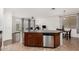 Open kitchen featuring island with breakfast bar and modern appliances at 2986 E Country Shadows St, Gilbert, AZ 85298