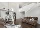 Bright living room featuring high ceilings, a cozy seating arrangement, and elegant decor elements at 2986 E Country Shadows St, Gilbert, AZ 85298