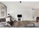 Inviting living room featuring hardwood floors, a comfortable sofa, and neutral decor at 2986 E Country Shadows St, Gilbert, AZ 85298